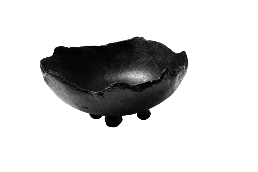 Black ceramic bowl on a white background